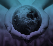 a globe being held in the palms of hands