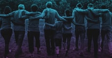 group of people with their arms around each other