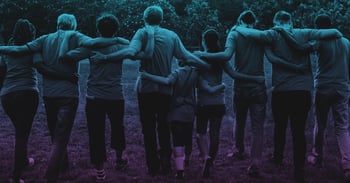 group of people with their arms around each other