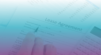 hand filling out Lease Agreement document